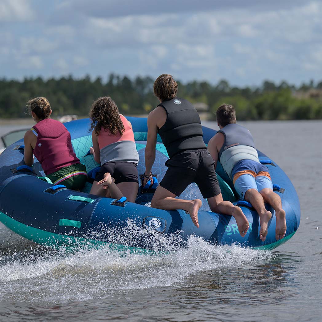 Radar Orbit 4 Person Tube in Teal / Blue, riders crossing the wake