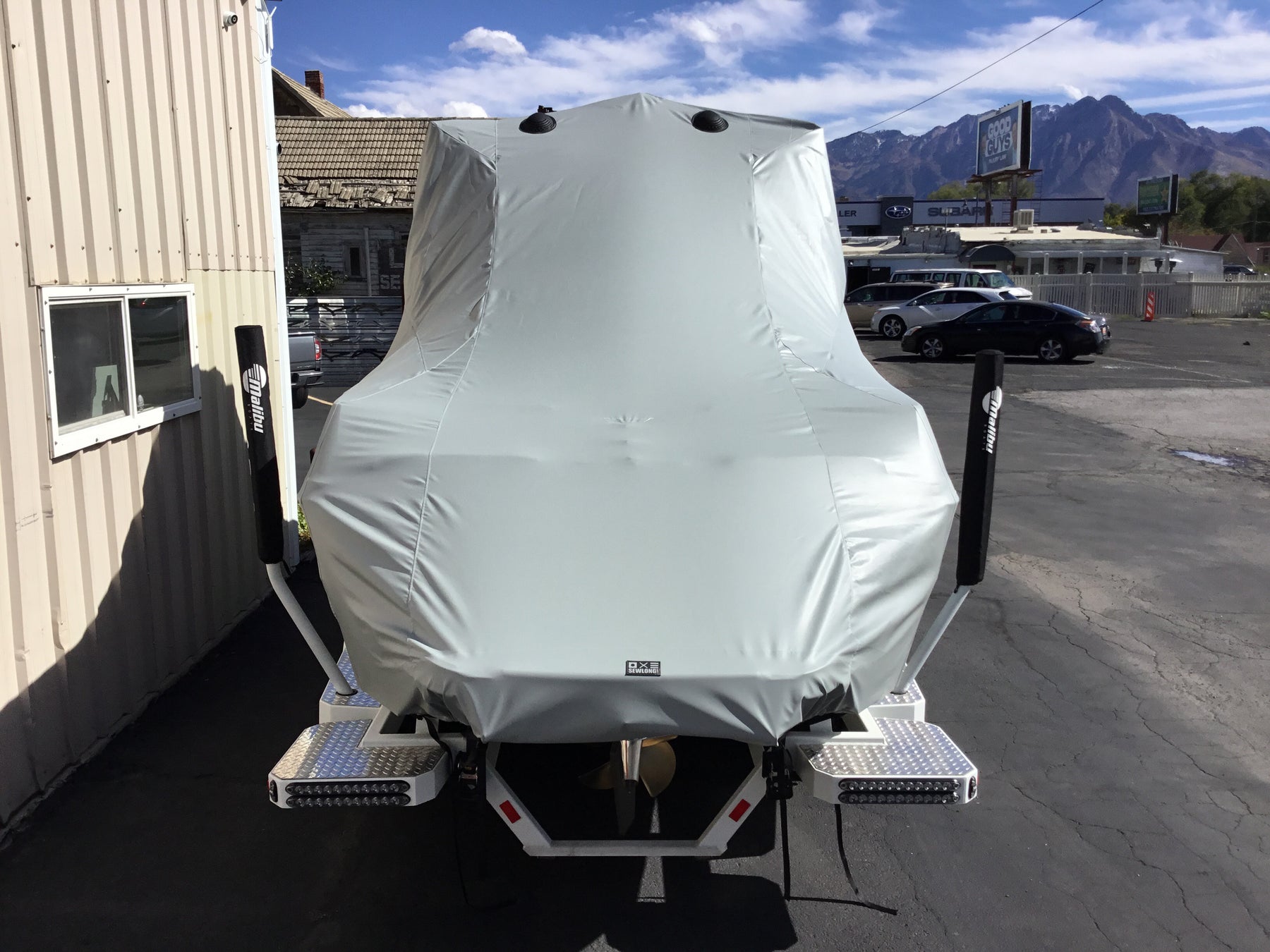 Malibu 23 LSV Wakesetter W/G5 Tower and Factory Bimini Double Up Storage Cover