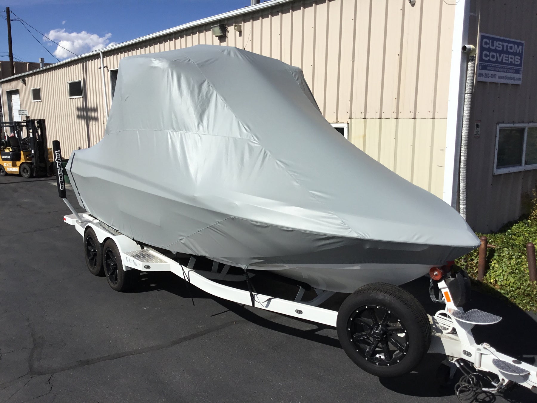 Malibu 23 LSV Wakesetter W/G5 Tower and Factory Bimini Double Up Storage Cover