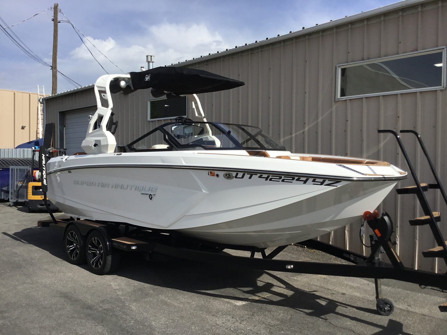 Nautique G25 with FCT19 Tower and Factory Bimini Double Up Storage Cover