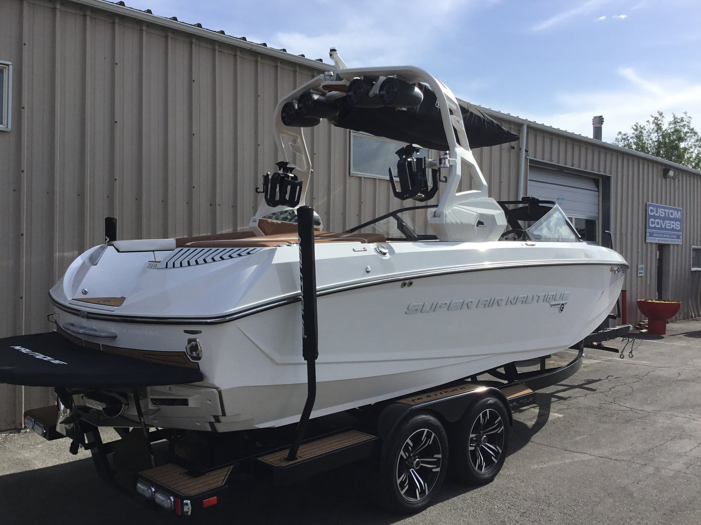 Nautique G25 with FCT19 Tower and Factory Bimini Double Up Storage Cover