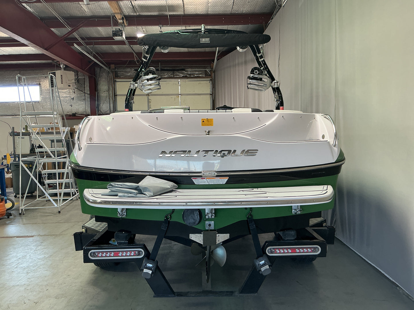 Nautique 210 with FCT-3 Tower and Sewlong Bimini Double Up Storage Cover