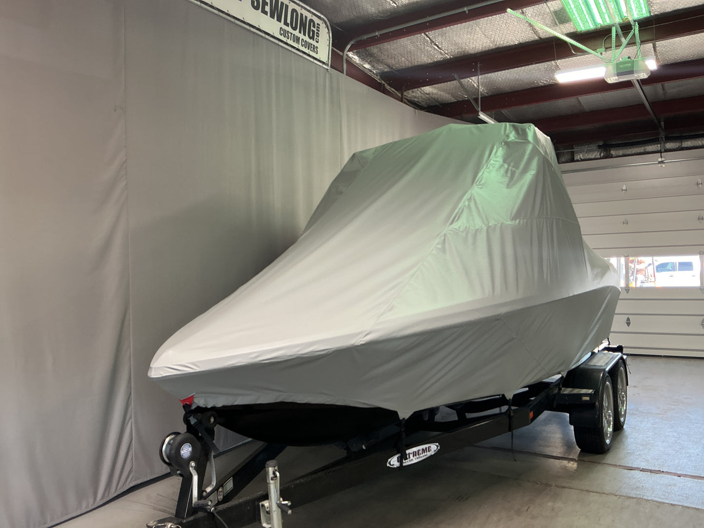 Nautique 210 with FCT-3 Tower and Sewlong Bimini Double Up Storage Cover