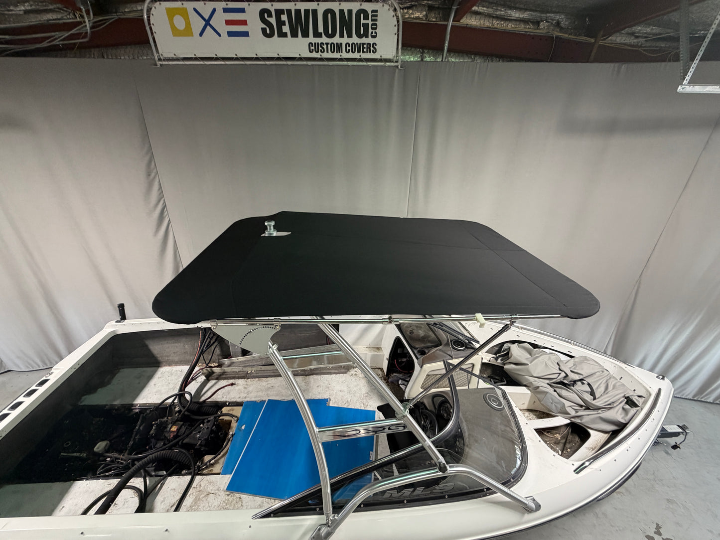 Malibu Wakesetter with Skylon Swoop tower Folding Canopy Top