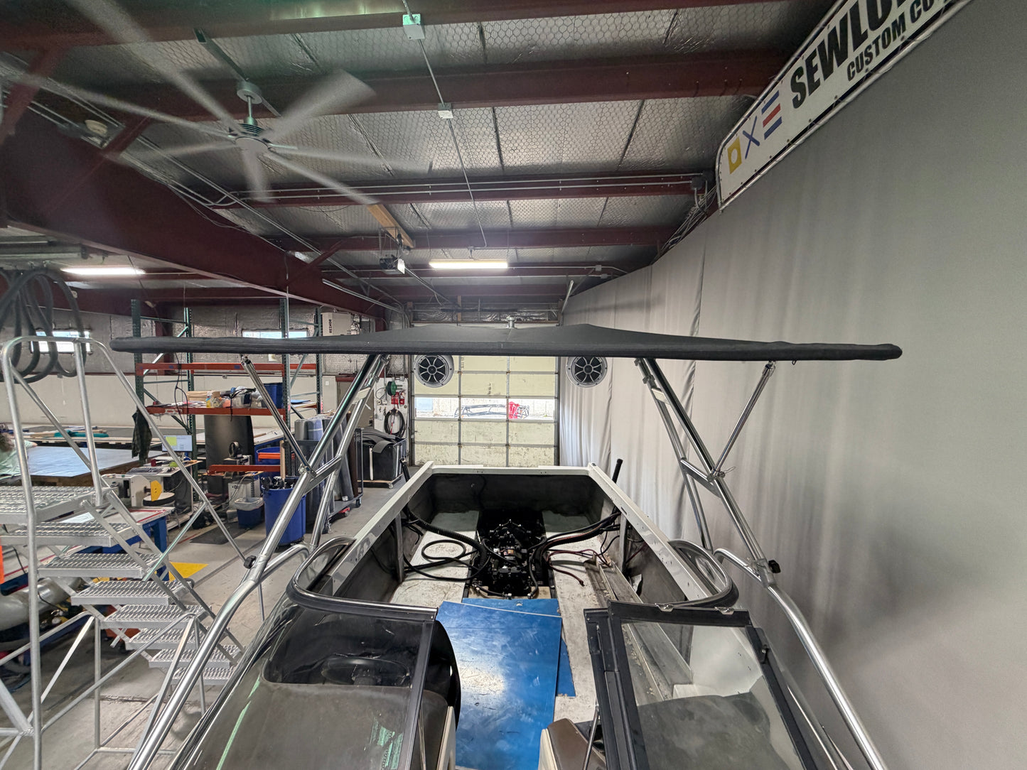 Malibu Wakesetter with Skylon Swoop tower Folding Canopy Top