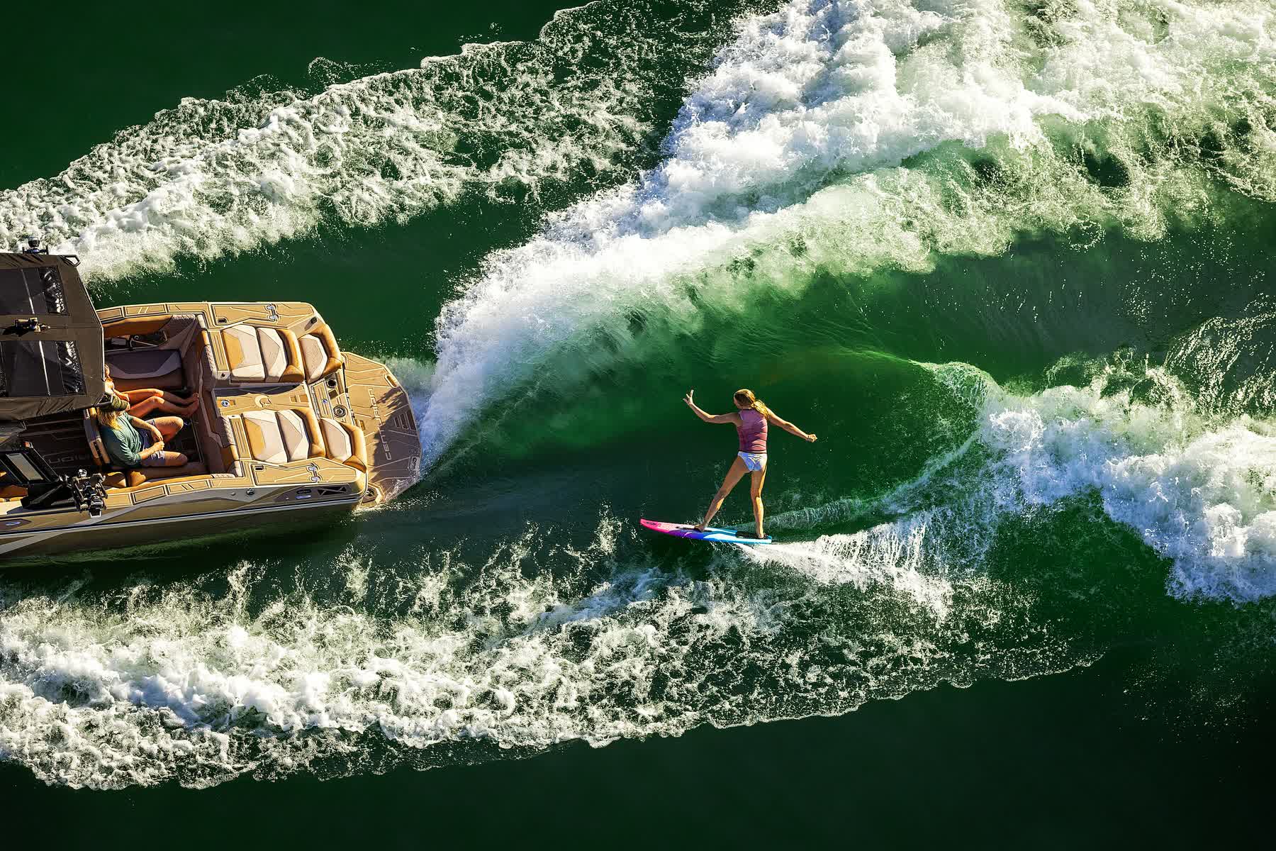 Wakesurfer riding a powerful Centurion RS wave