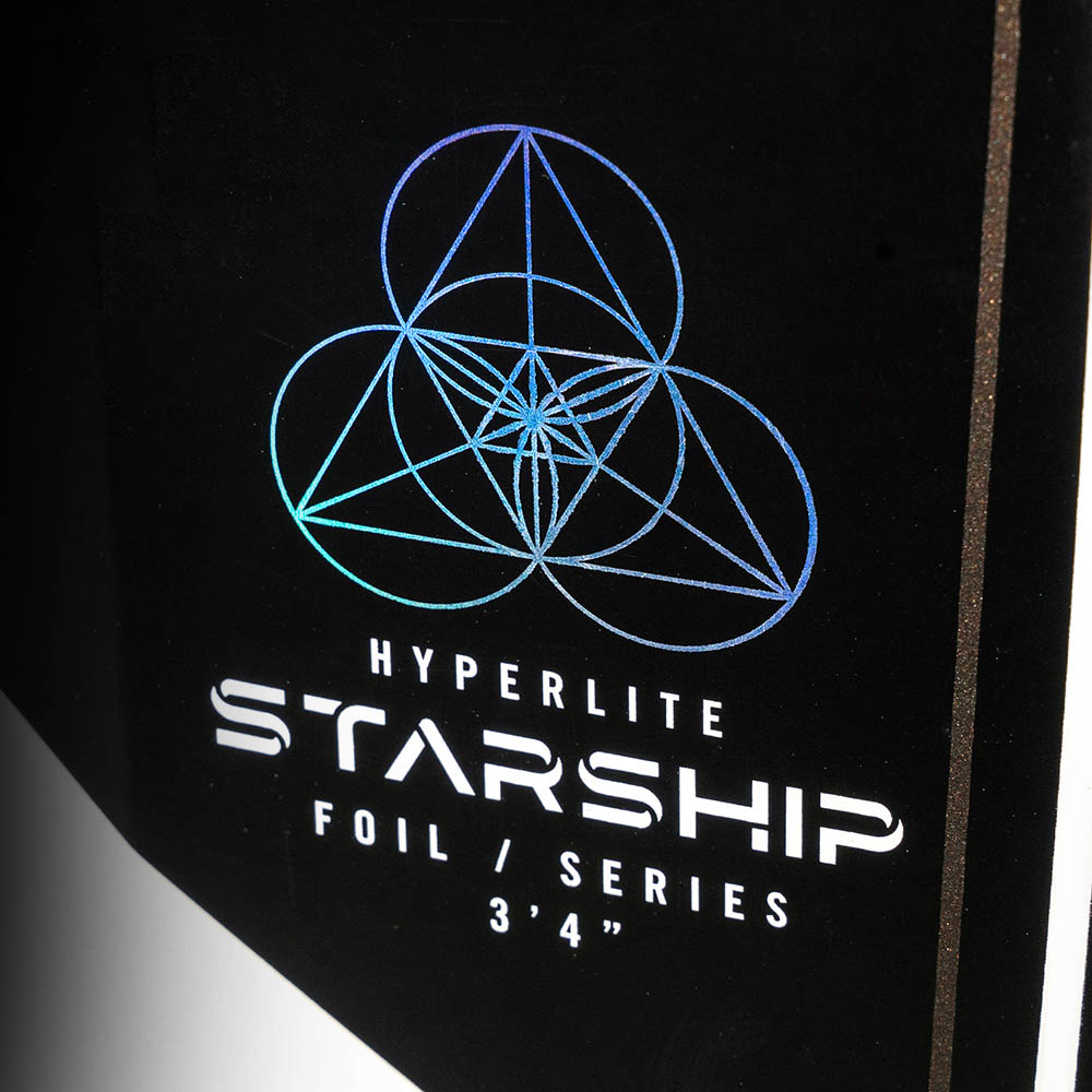 Hyperlite Starship Wake Foil Board 2027, iridescent Starship Foil Series logo on the black circuit-pattern underside