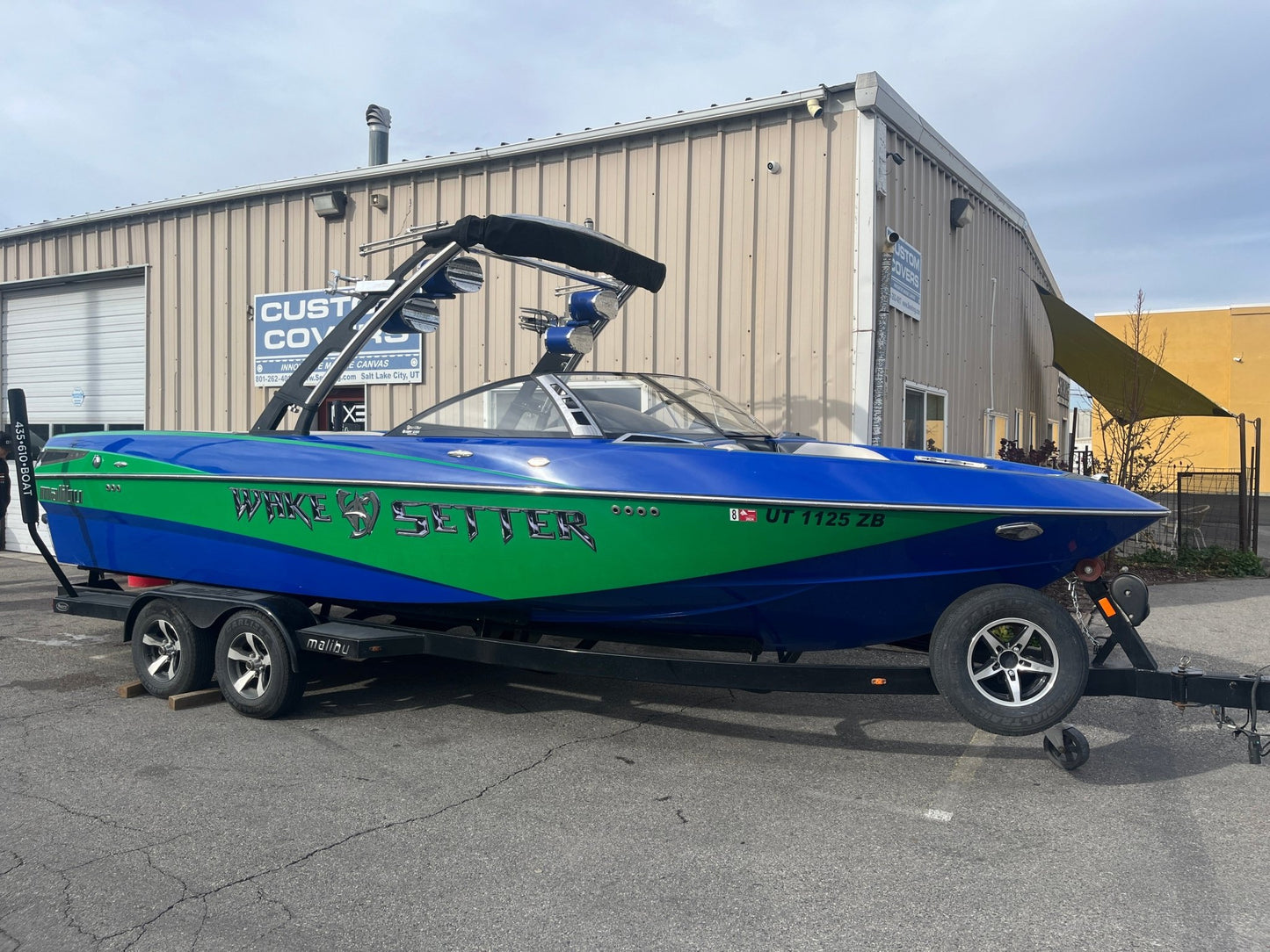Malibu 247 with Illusion G3 tower and factory bimini Double Up Storage Cover - BoardCo