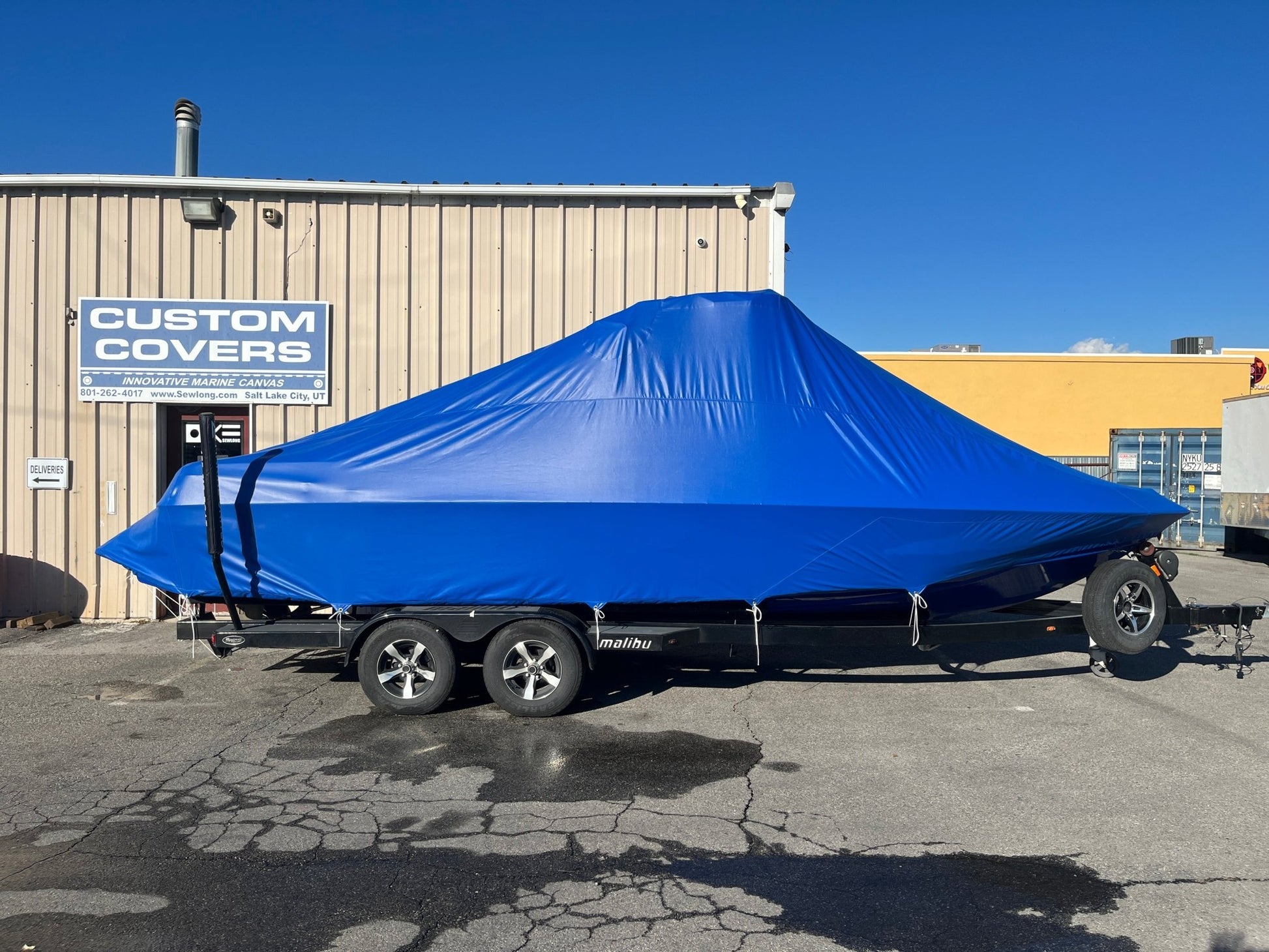 Malibu 247 with Illusion G3 tower and factory bimini Double Up Storage Cover - BoardCo