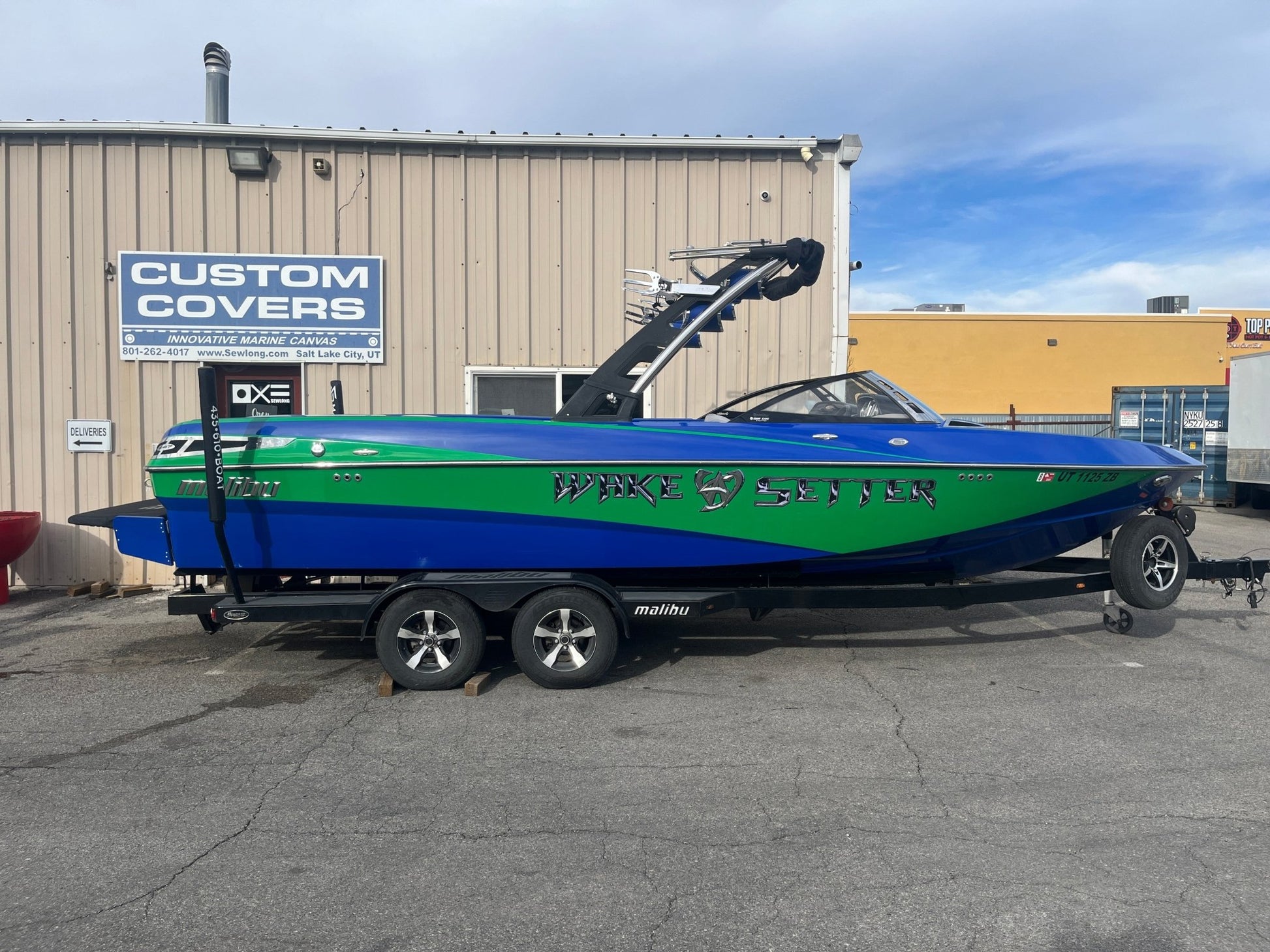 Malibu 247 with Illusion G3 tower and factory bimini Double Up Storage Cover - BoardCo