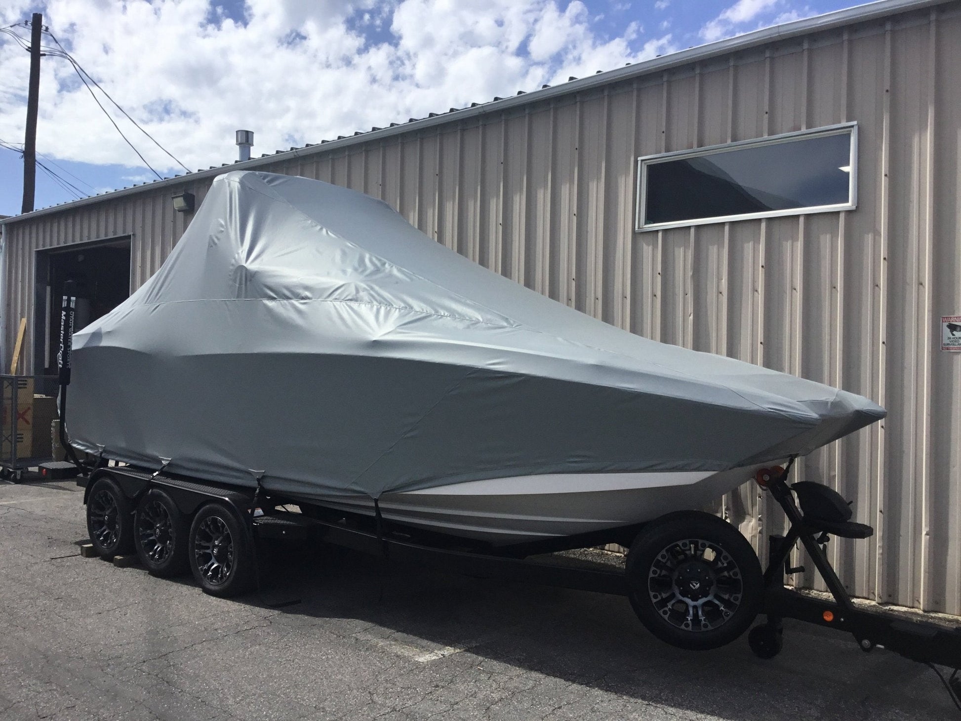 MasterCraft X24 with ZFT8 - ZFT10 tower and factory bimini Double Up Storage Cover - BoardCo