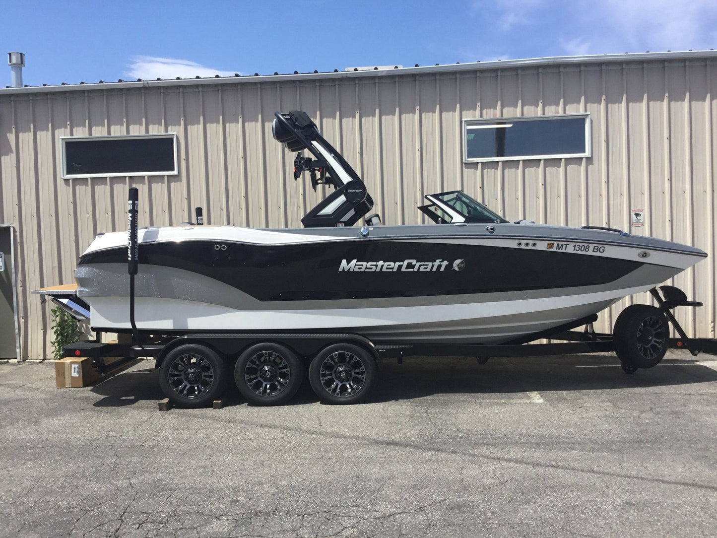 MasterCraft X24 with ZFT8 - ZFT10 tower and factory bimini Double Up Storage Cover - BoardCo