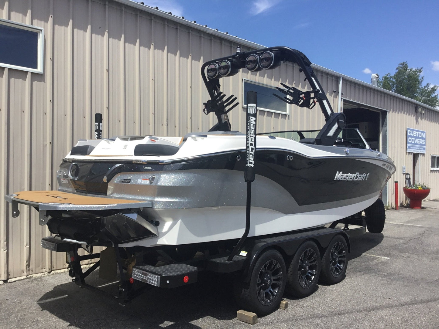 MasterCraft X24 with ZFT8 - ZFT10 tower and factory bimini Double Up Storage Cover - BoardCo