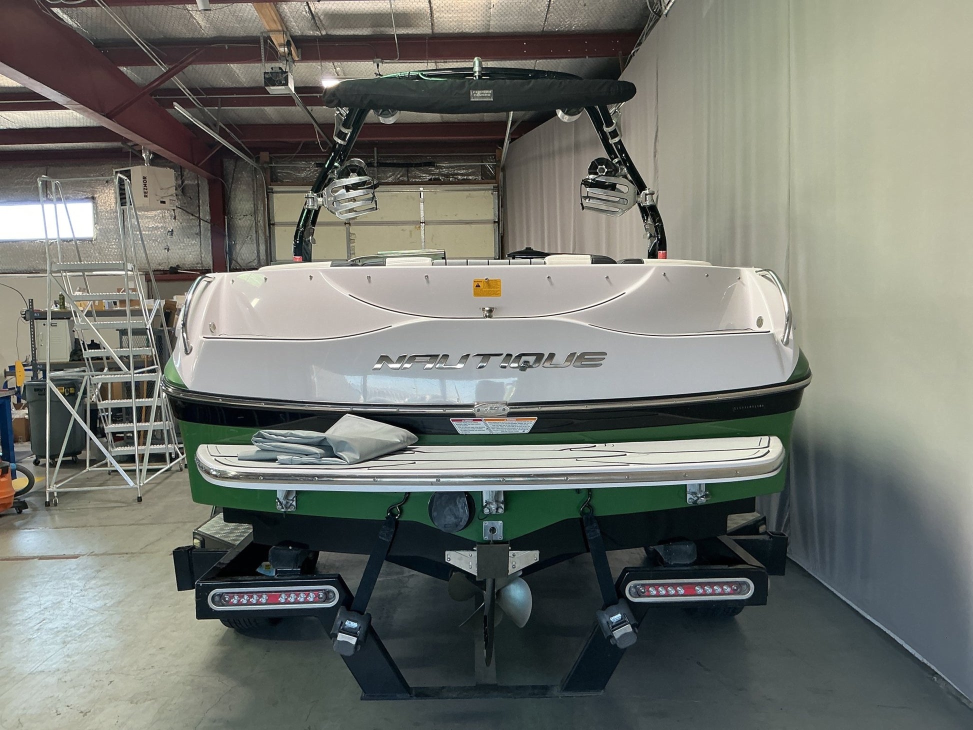 Nautique 210 with FCT - 3 Tower and Sewlong Bimini Double Up Storage Cover - BoardCo