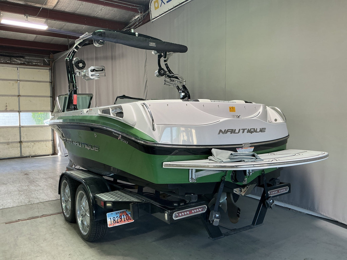 Nautique 210 with FCT - 3 Tower and Sewlong Bimini Double Up Storage Cover - BoardCo