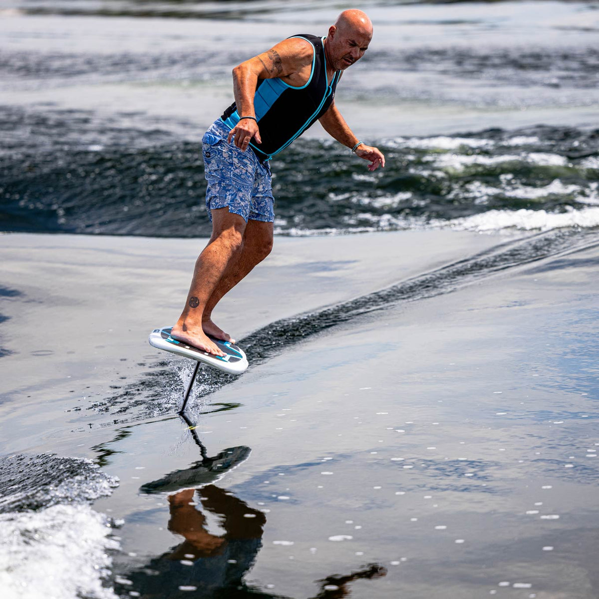 Phase 5 Gizmo V2 Wake Foil Board 2027 – rider and foil board above the water
