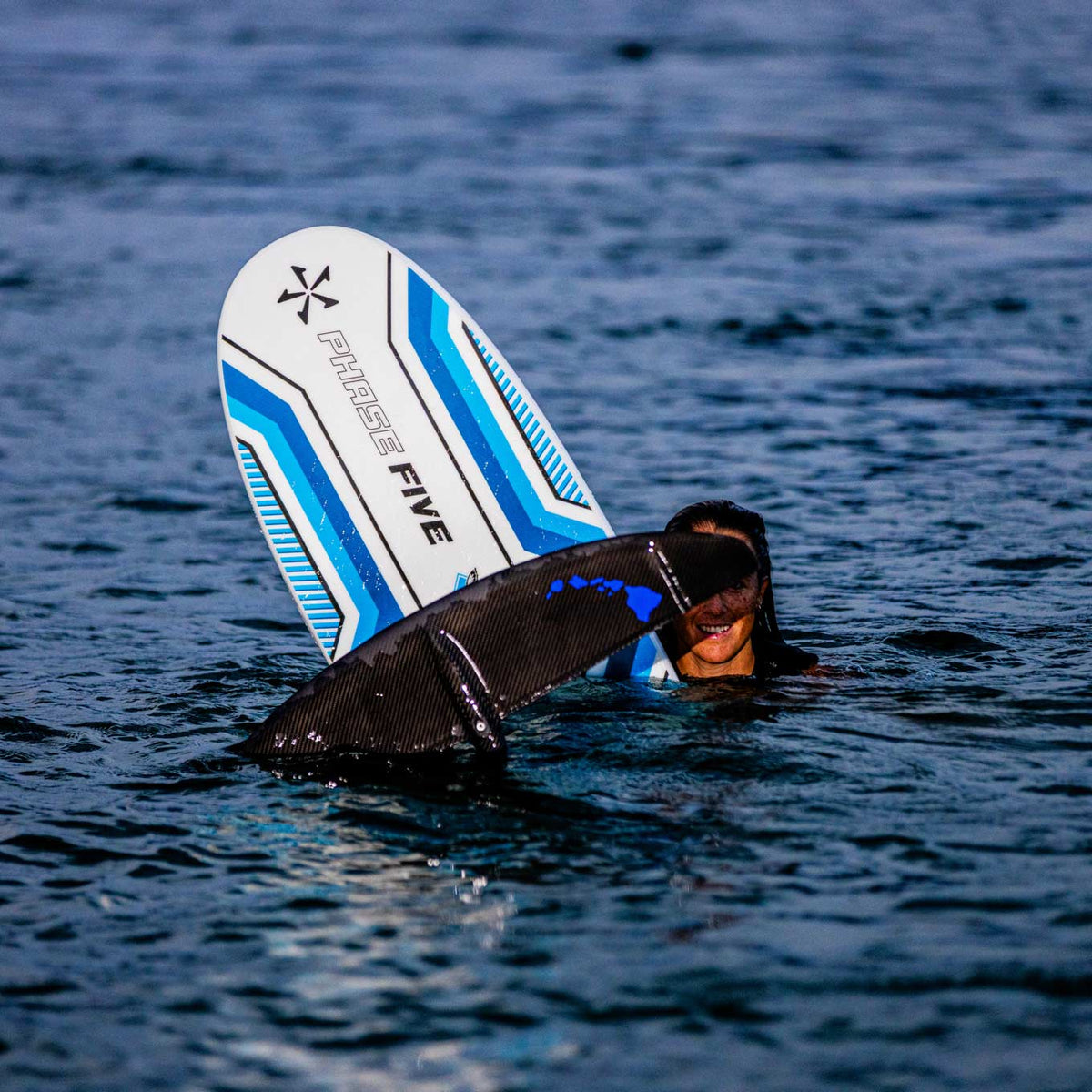 Phase 5 Gizmo V2 Wake Foil Board 2027 – rider floating beside the board