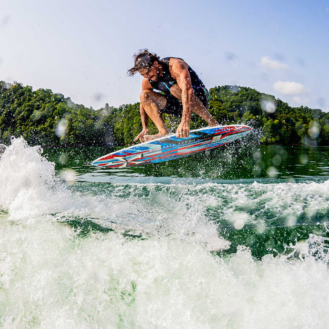 Phase 5 Key CL Wakesurf Board 2027 – rider and board during an aerial maneuver