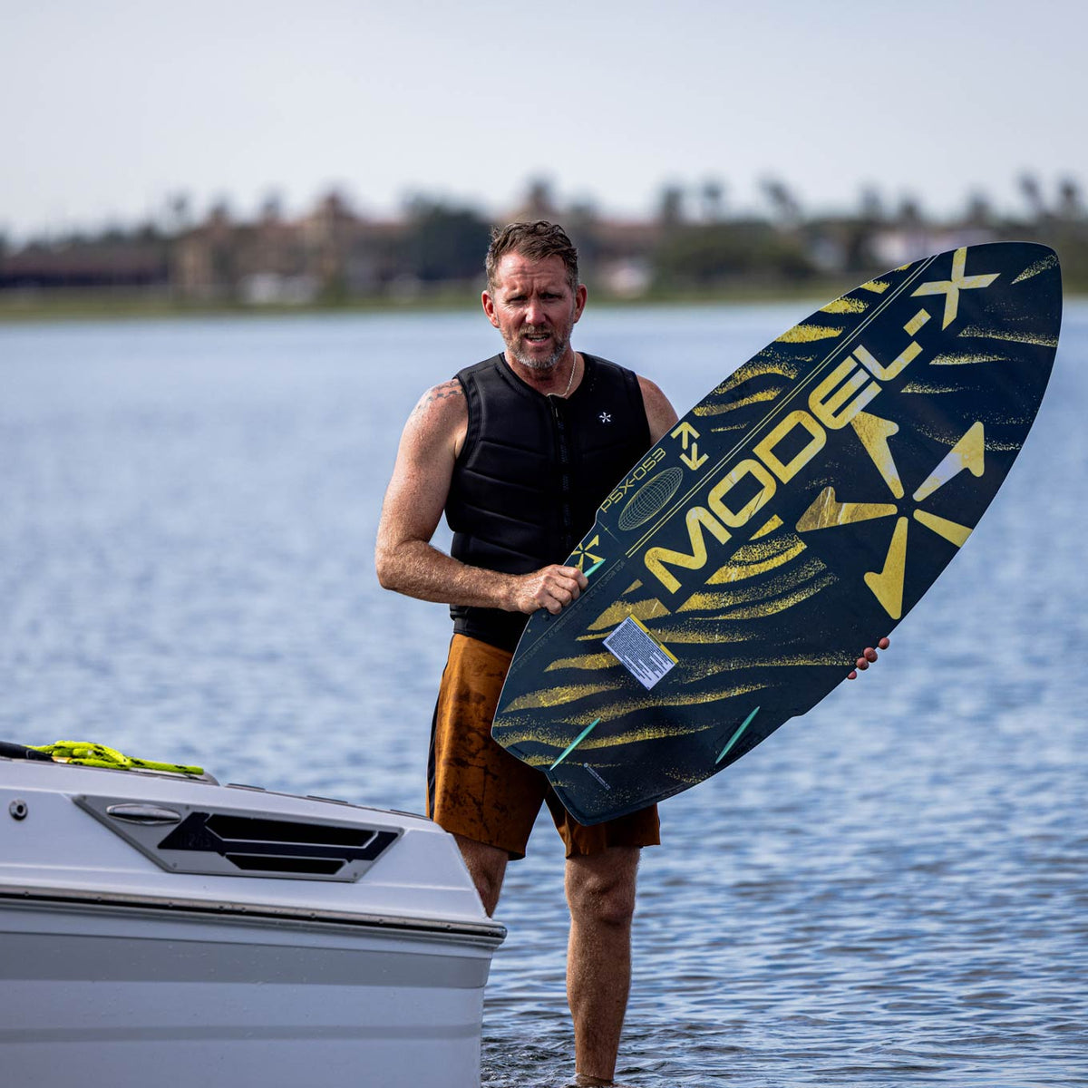 Phase 5 Model X LTD Wakesurf Board 2027 – board and rider outdoors