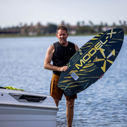 Phase 5 Model X LTD Wakesurf Board 2027 – board and rider outdoors