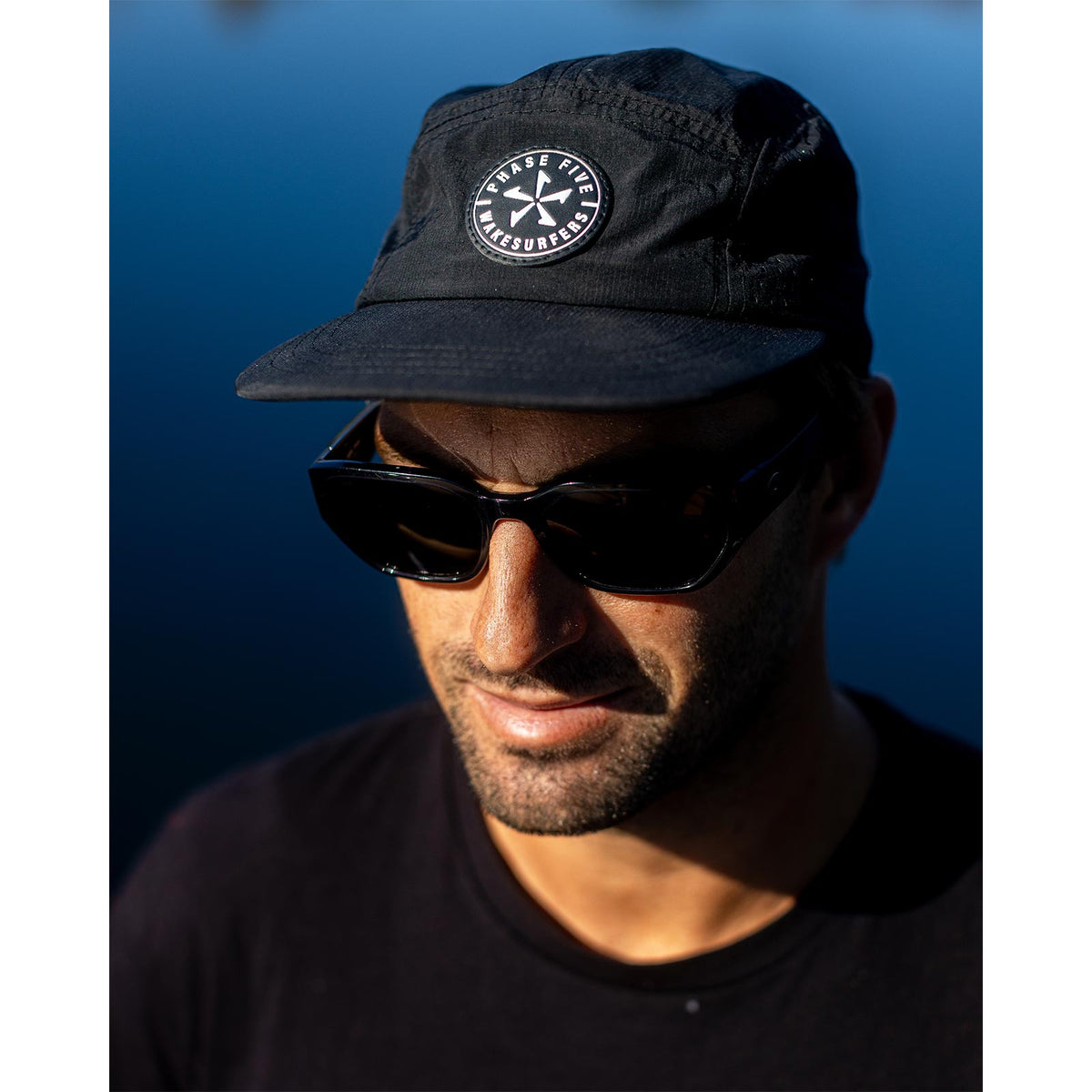 Phase 5 Classic Logo Camper Hat, worn by the water