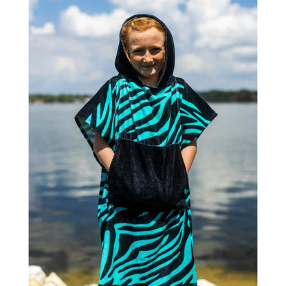 Phase 5 Zebra Hooded Kids Towel, worn by a child beside the lake