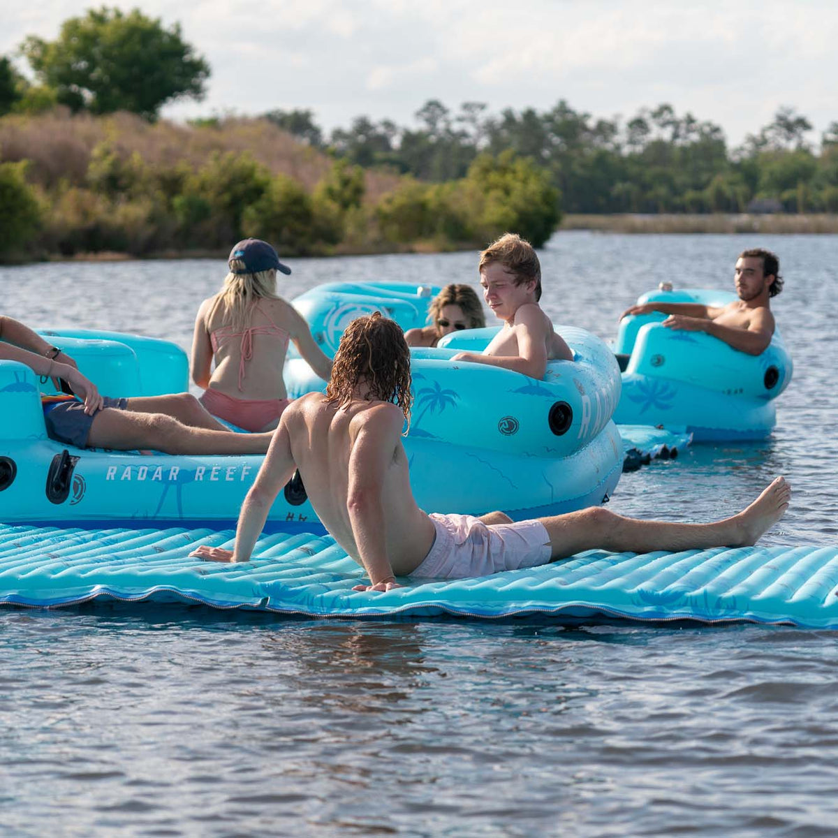 Radar Cloud Water Mat 5 ft. x 10 ft., lounging on the water