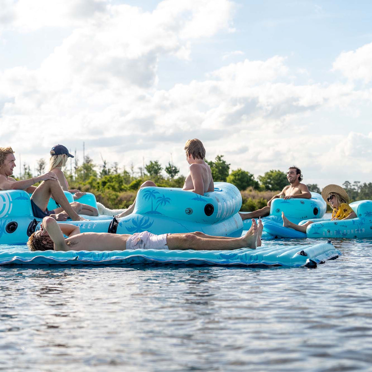 Radar Cloud Water Mat 5 ft. x 10 ft., lounging on the water