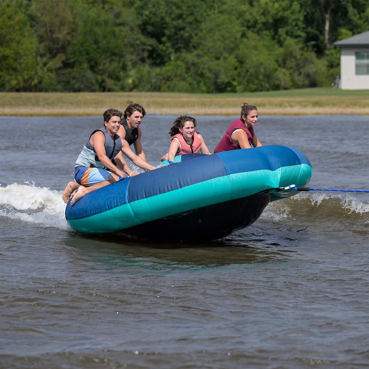 Radar Orbit 4 Person Tube in Teal / Blue, riders crossing the wake